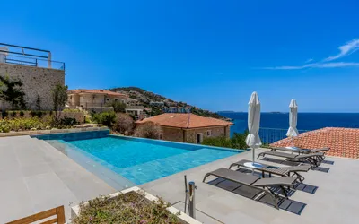 Elegant villa with infinity pool overlooking the Mediterranean Sea.
